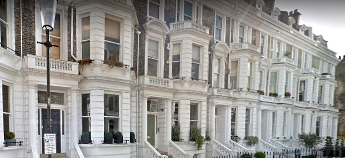 Picture of row of white Victorian houses Built in 1870 this is a good example of classical Italianate style